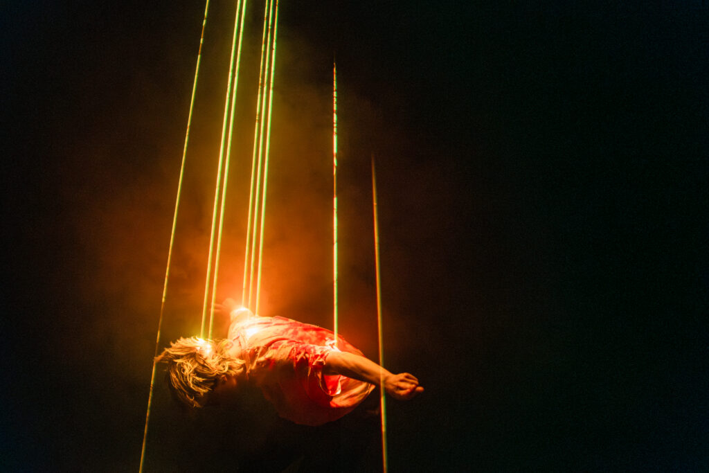 performer dancing with laser